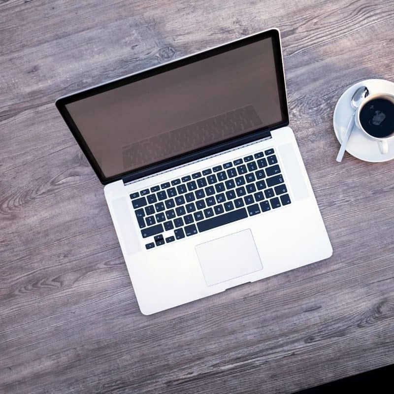 Laptop and coffee cup on a table