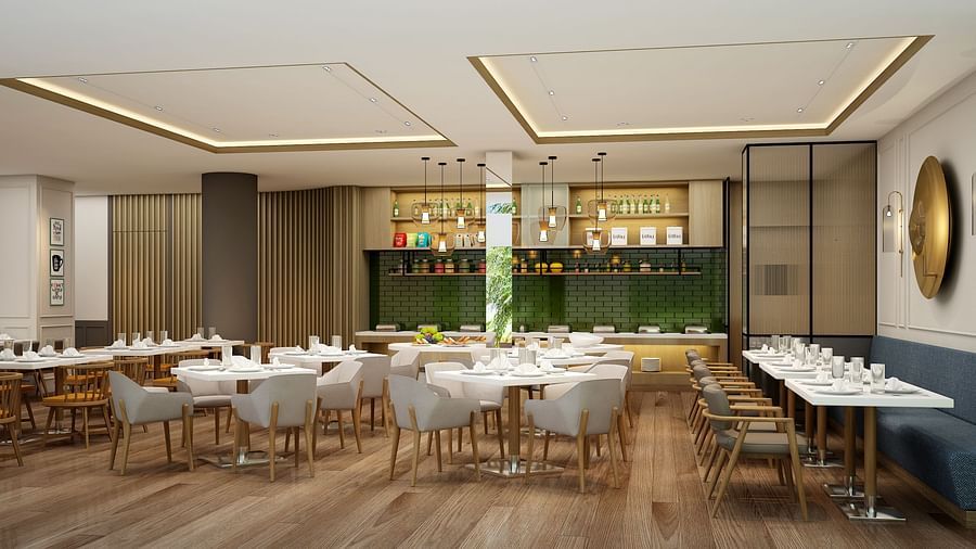 Restaurant with tables and chairs and wooden flooring -  Sarovar Portico Srinagar