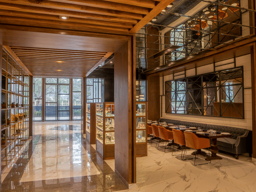 An image of a seating area with several seats and tables -  Hotel Polo Towers, Agartala