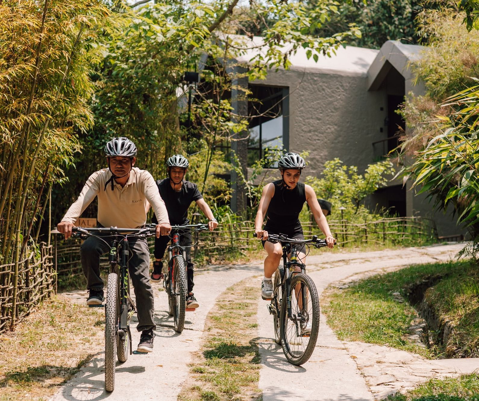 Front view of three young boys cycling in a pavement | Kavya Resort and Spa, Nagarkot