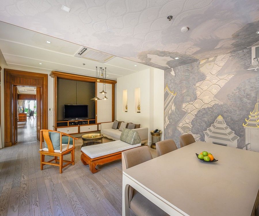 alt-text image of the living room featuring a dining area overlooking a television - one bedroom private pool beachfront villa