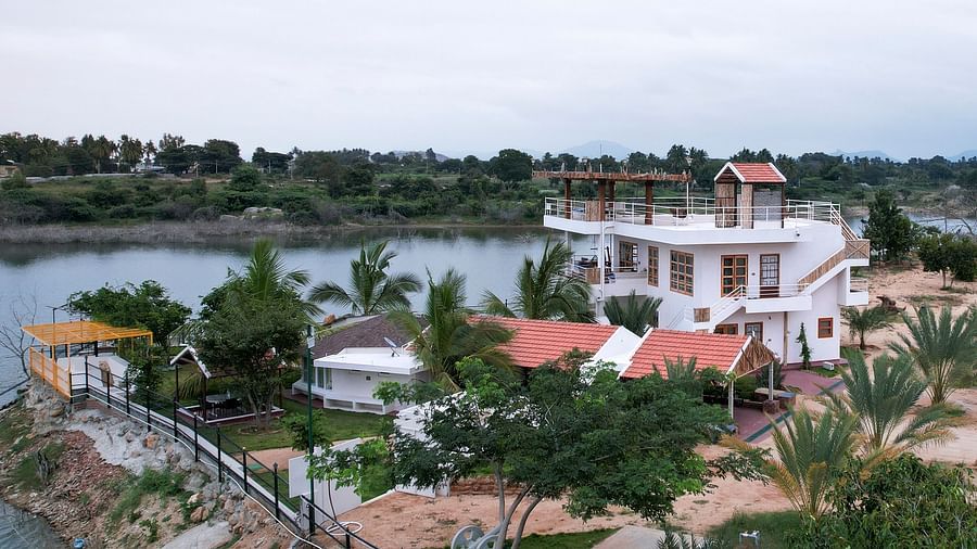Birds eye view of a property next to  a water body