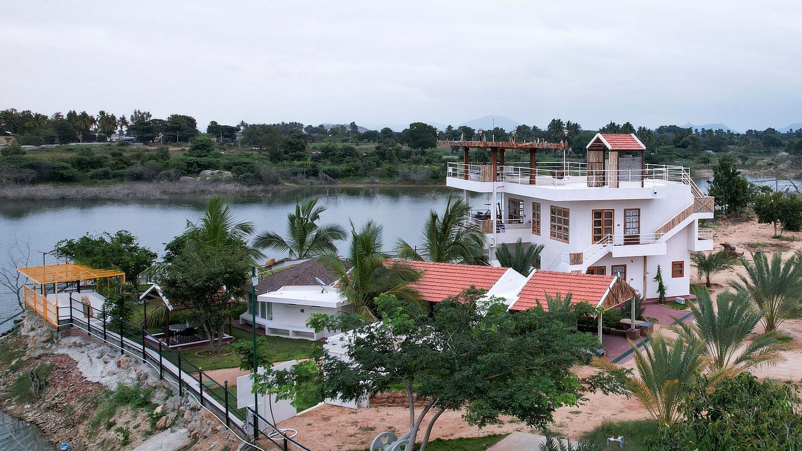 Birds eye view of a property next to  a water body