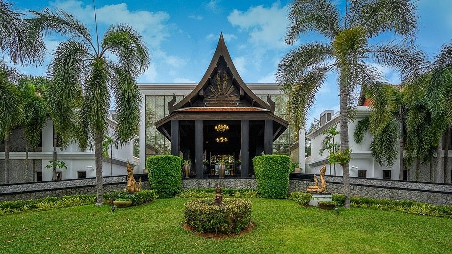 image of the entrance with a serene green lawn in the foreground - Maikhao Dream Villa Resort & Spa, Phuket
