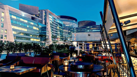 Outdoor cafe and fine dining patio area at DLF CyberHub in Gurgaon, India.