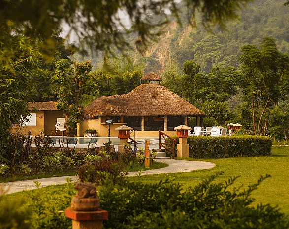 Outdoor wedding venue with a gazebo and lawn.