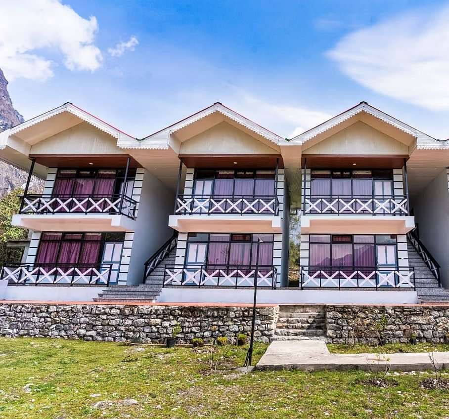 Facade of Whispering Pines By Summit, Lachung, featuring a charming garden in front and a bright