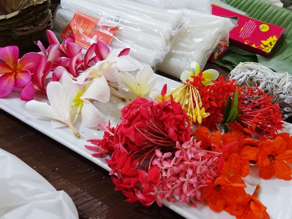 Colourful arrangement of flowers and gift items on a table.