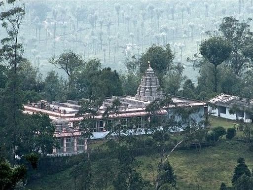 an image of aerial view of an ancient temple surrounded by trees