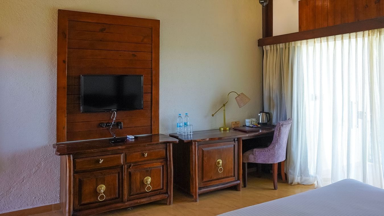 bedroom with various amenities like TV and work desk at Jagira Ananta Elite