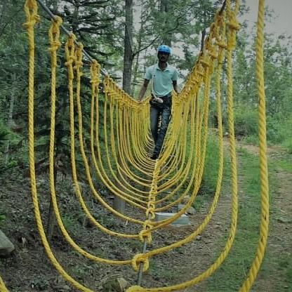 image of a man experiencing the Burma Bucket at grand palace in yercaud