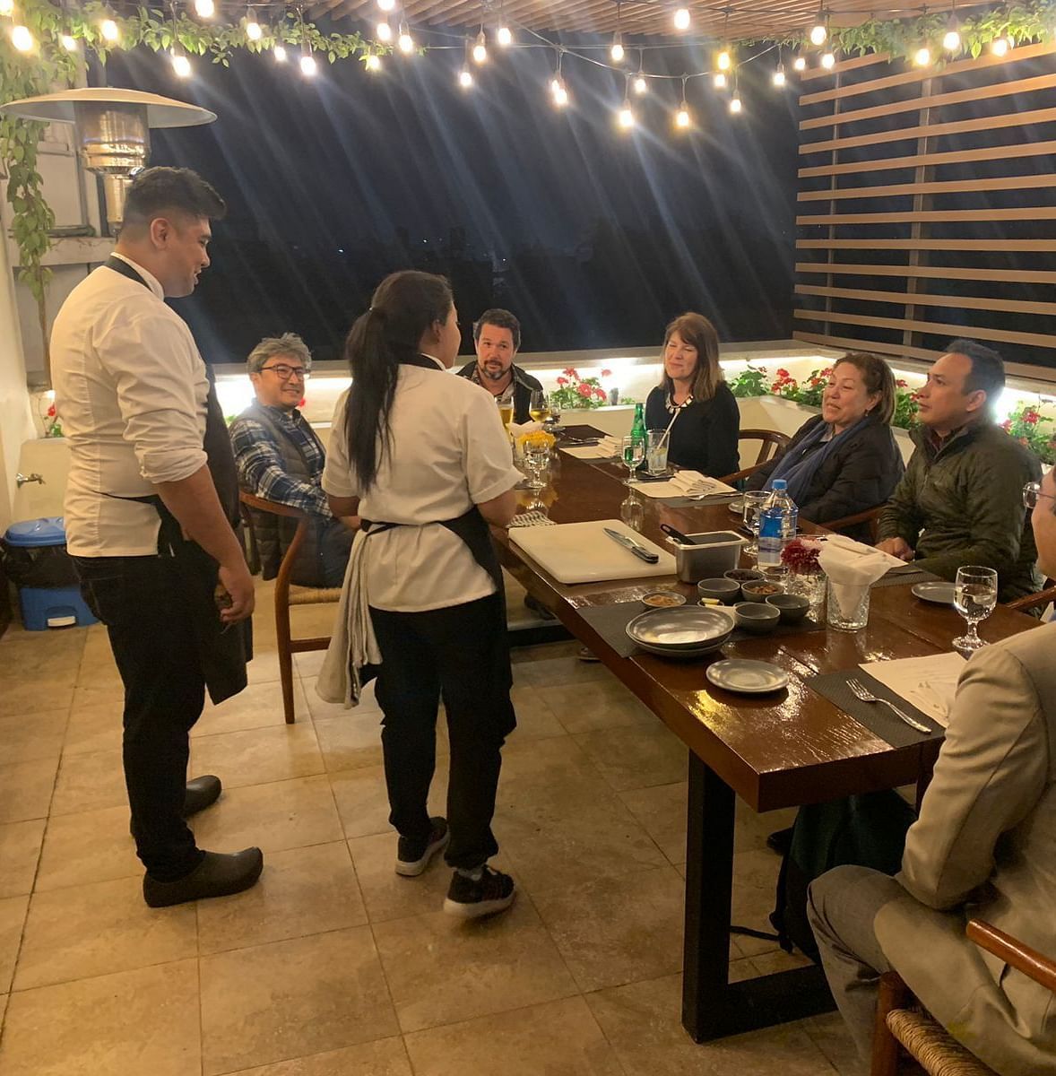 A group of people gathered for the chefs table dinner
