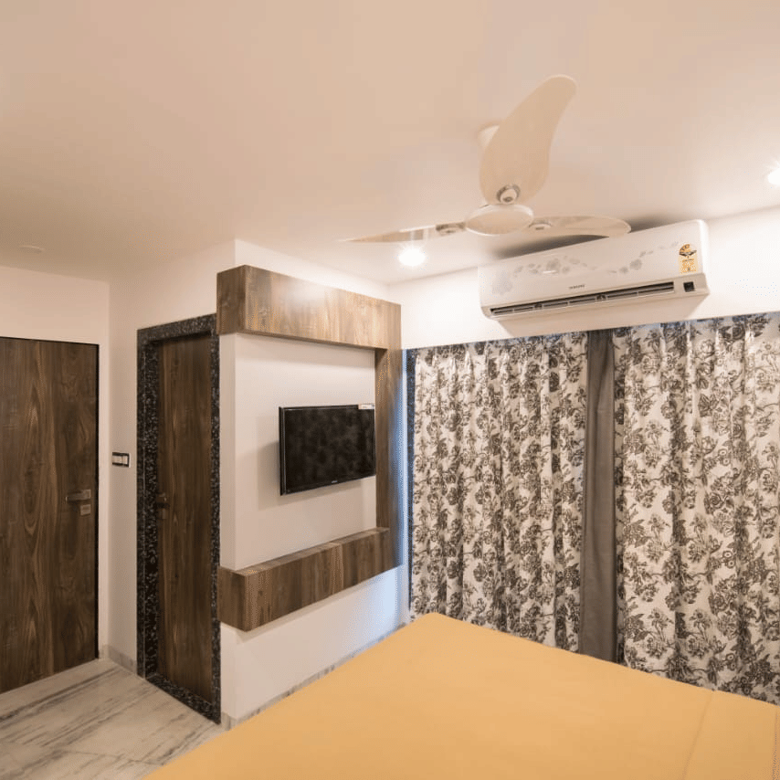 The royal suite of sanmukh by Adamo showcasing the wooden interior and clean ambience.