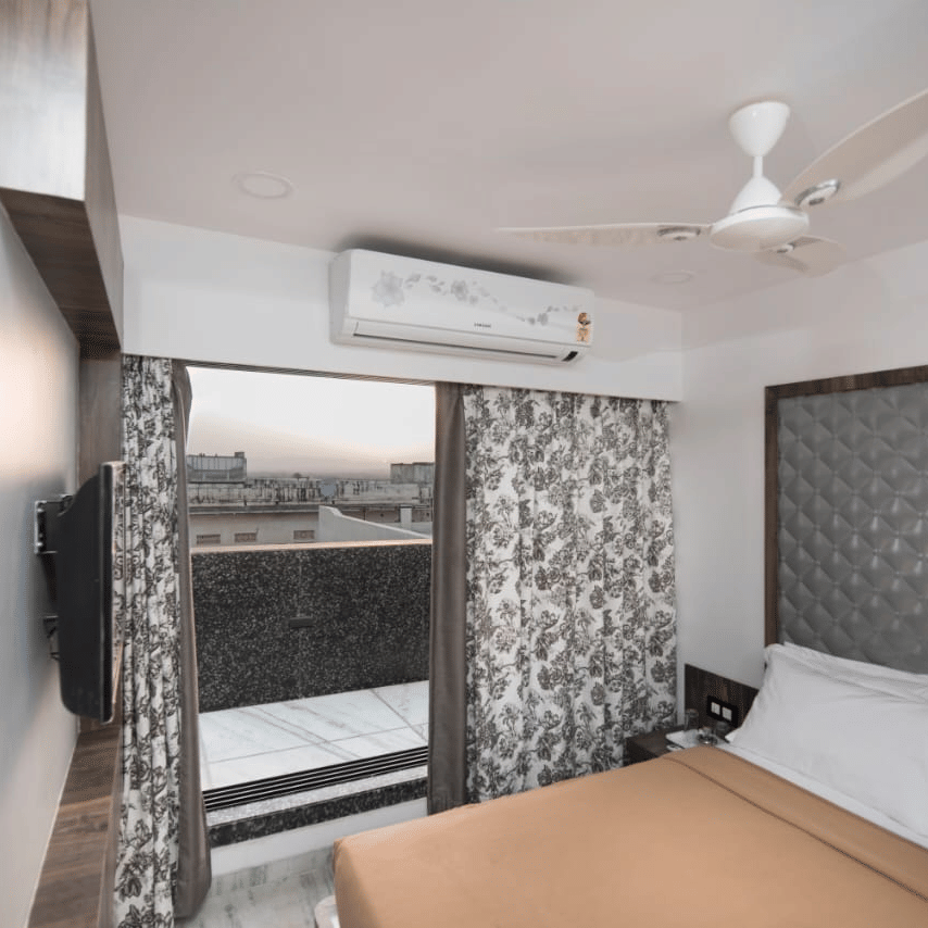 royal suite room with its posh interiors and a spacious balcony in the view.