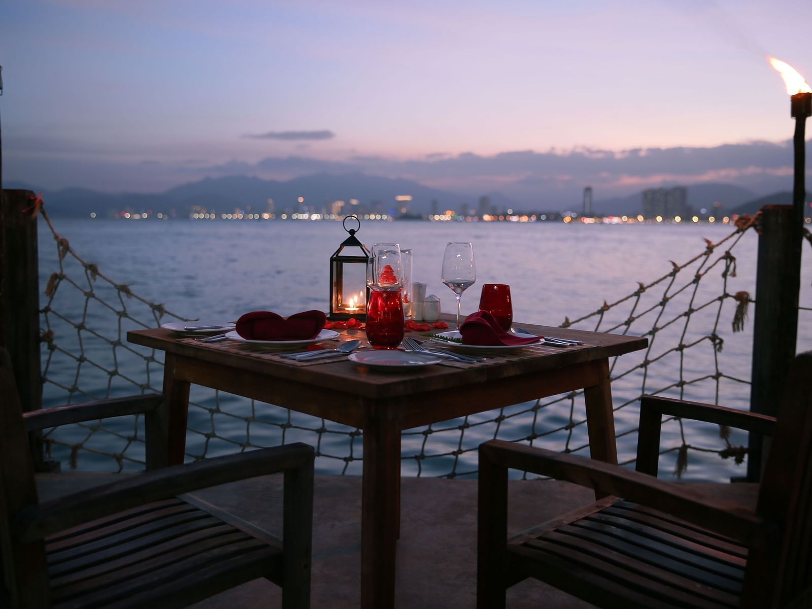 Another view of a candle light dinner setup by the Nha Trang bay - Alibu Resort Nha Trang