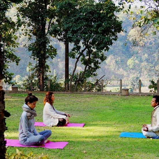 yoga therapy with two clients and a yoga instructor