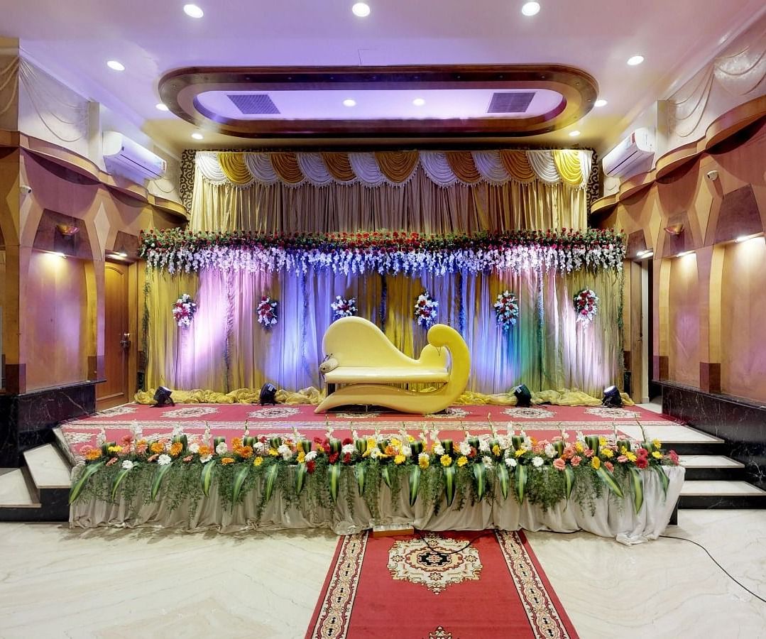 View of a brightly lit stage for a wedding occasion in Sammilan Hall