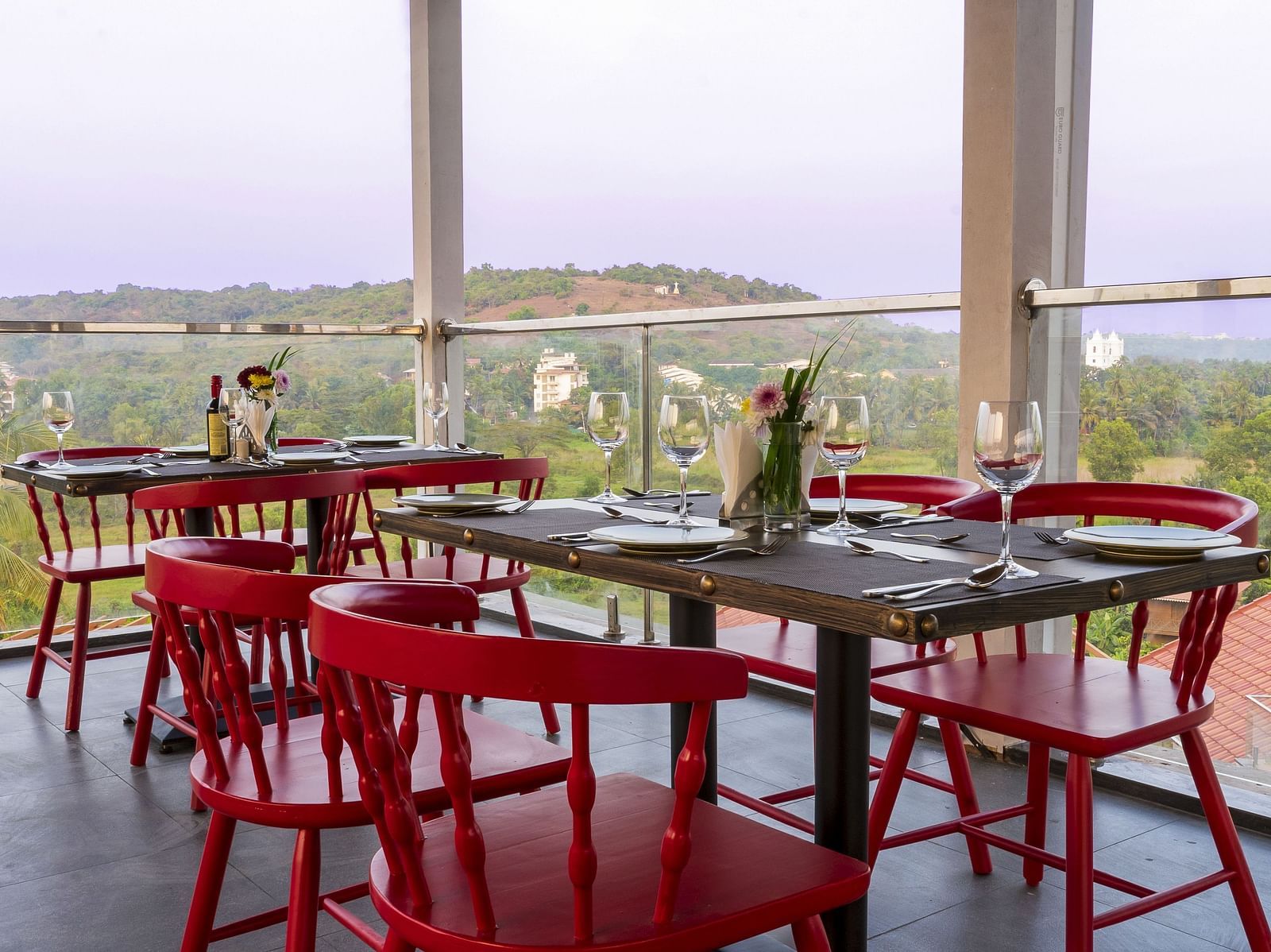 A al fresco seating arrangement inside the in-house restaurant - The Tanisi Hotels & Resorts, Goa