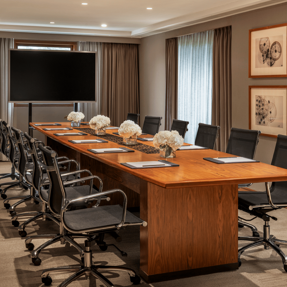 Meeting room with long wooden table and chairs at The Raintree, St. Mary’s Road.