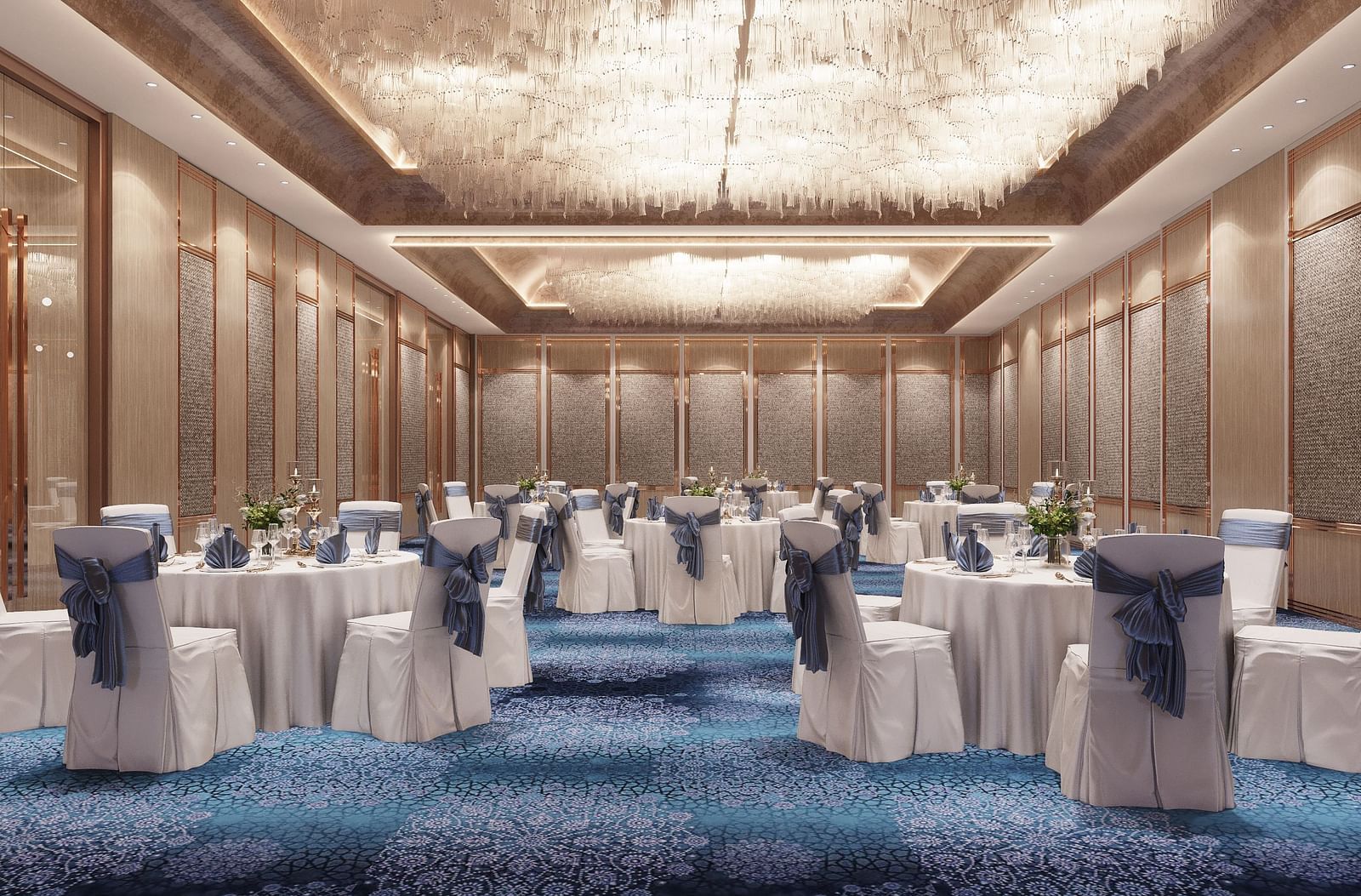 Interior view of a large ballroom or event space with round tables set with white linens and blue chair covers.