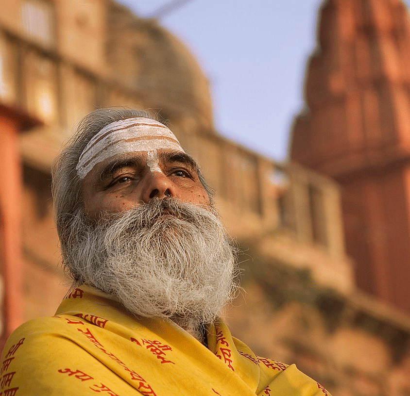 A close shot of a man with grey bread  - Ganga Lahari, Haridwar