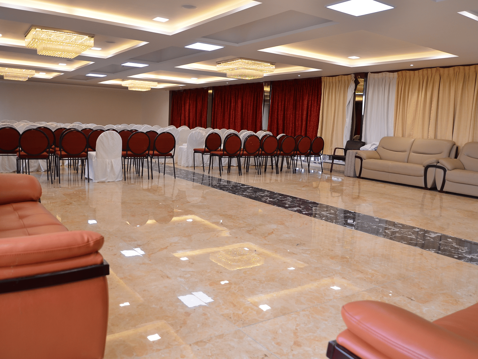 Spacious banquet hall with elegant lighting and comfortable seating, ideal for events and functions - Benzz Park, Kodaikanal