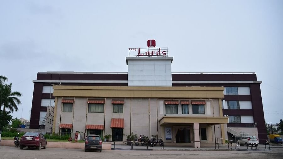Exterior view of Rang Lords Inn, Bharuch, with a WhatsApp image overlay, showing the building and surroundings