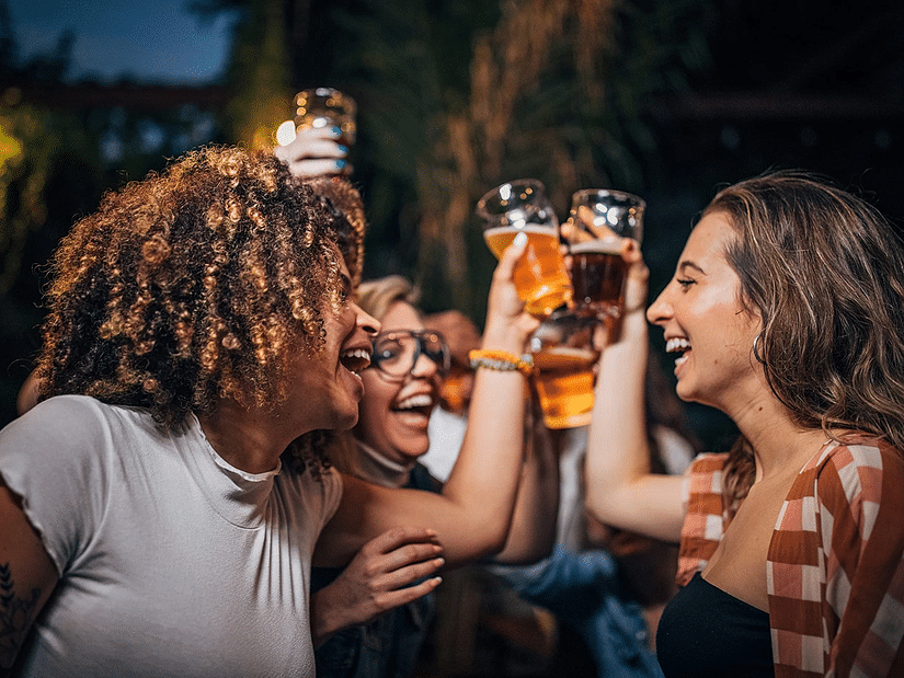A group of friends enjoying drinks during an evening - S Hotel Kingston, Jamaica
