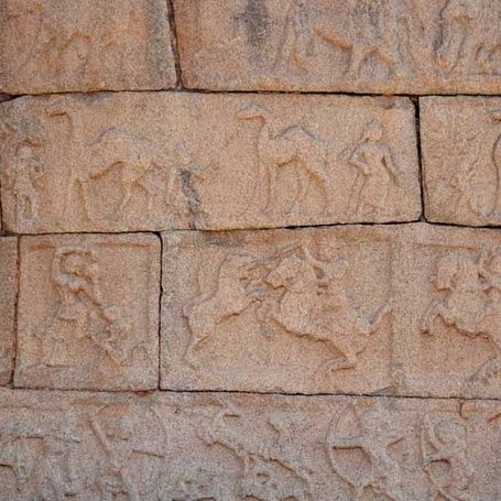 Hampi stone bas-reliefs of camels, horses, and elephants.