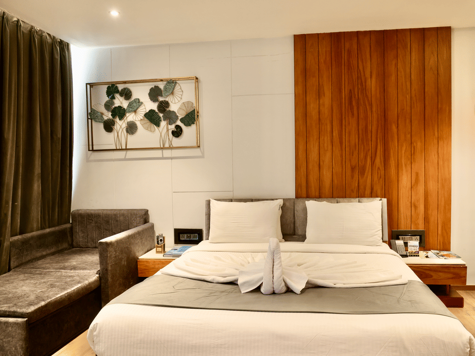 Skyline by Miraya, Premier Room, Bed with day bed and framed botanical art