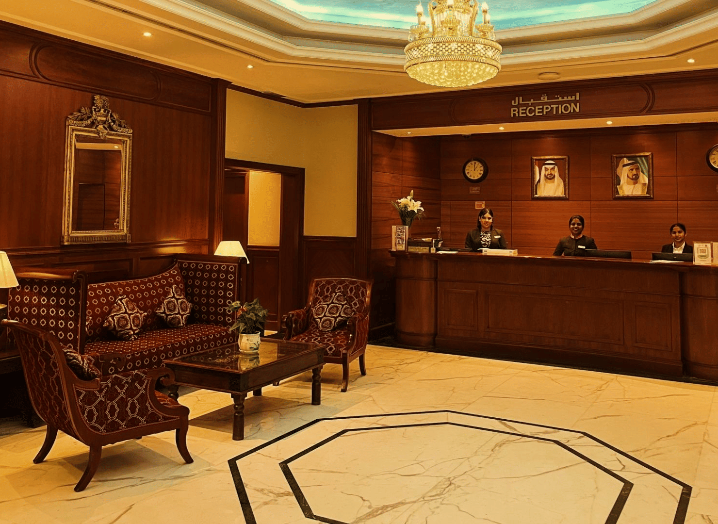 A hotel reception area with furniture at Marco Polo Hotel.