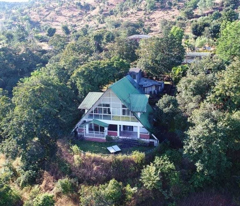 Aerial view of Wind Chalet Resort surrounded by trees.