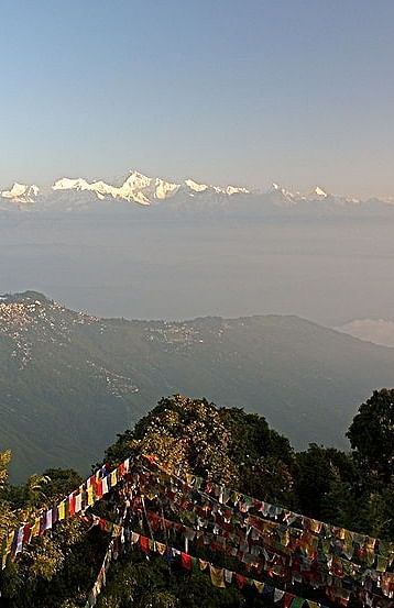 View of a valley with snow-capped mountains in the far distance