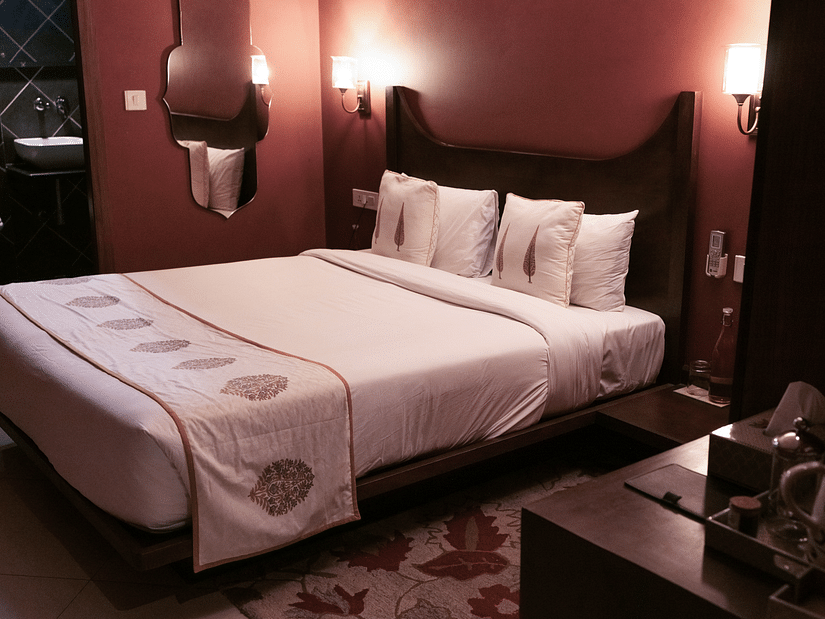 A bedroom with a double bed and side tables - 9