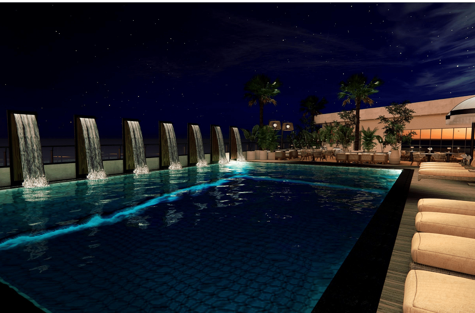 Image of swimming pool at night with lounge chairs on the side at Ramada Encore by Wyndham Gurugram Dwarka Expressway.