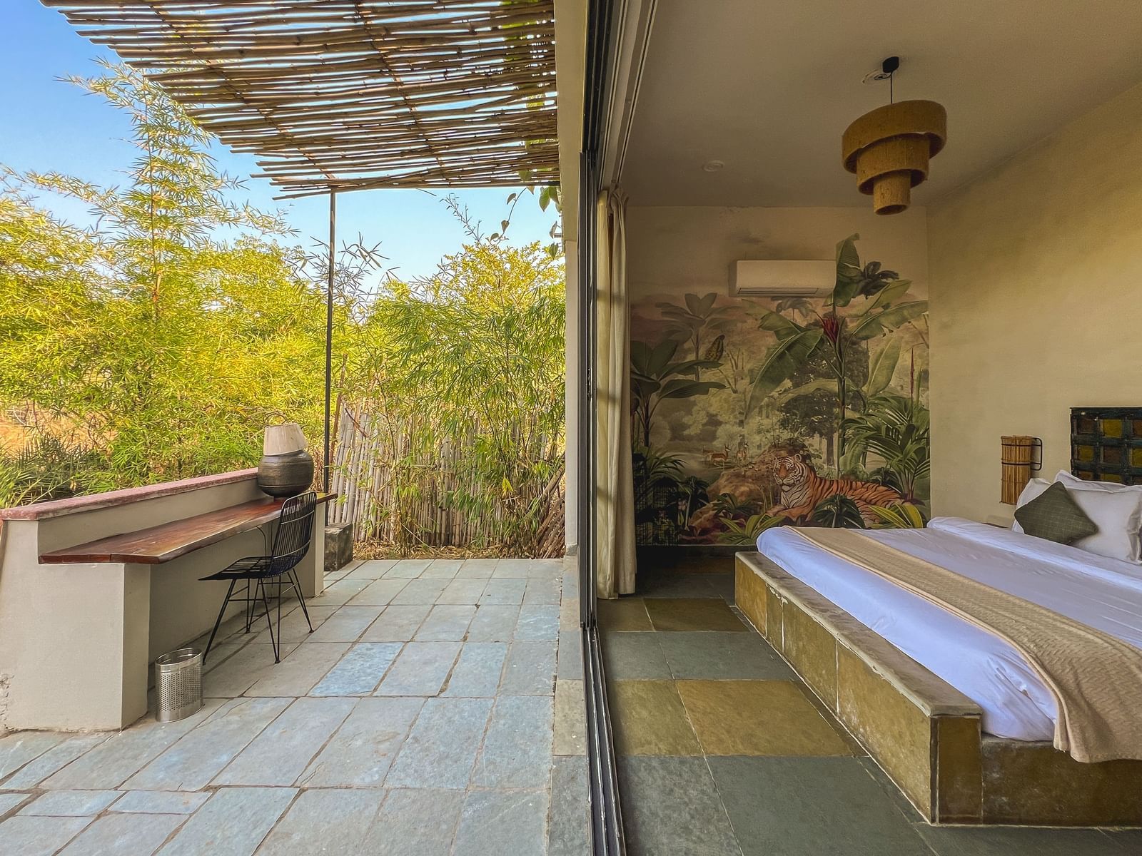 An image of the Stone Cabin with a balcony open to the lush greenery - Utsav Camp Sariska