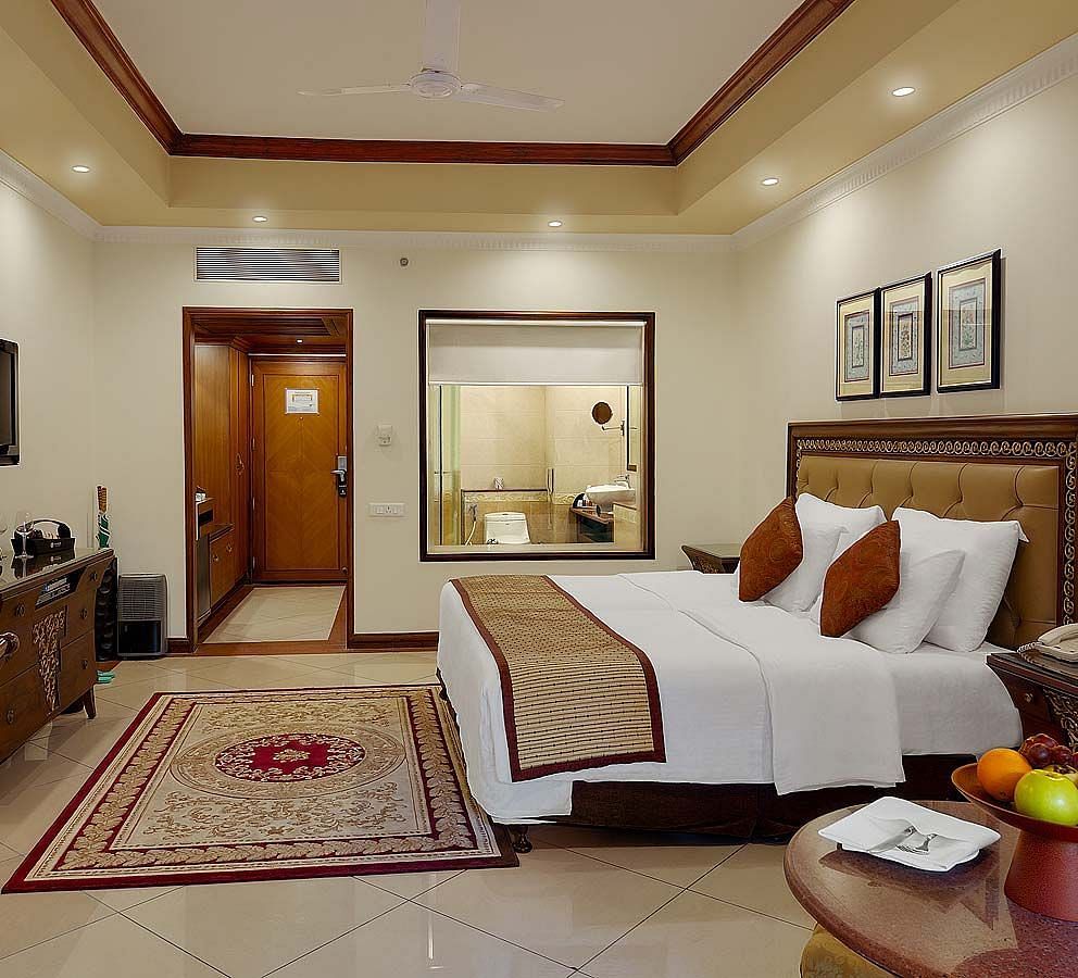 a king size bed offered at the club room - Mayfair Lagoon, Bhubaneswar 1