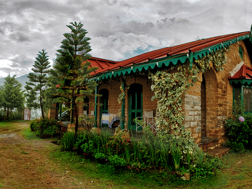 Facade and exterior of cottages captured during the day - Ramgarh Bungalows, Nainital.