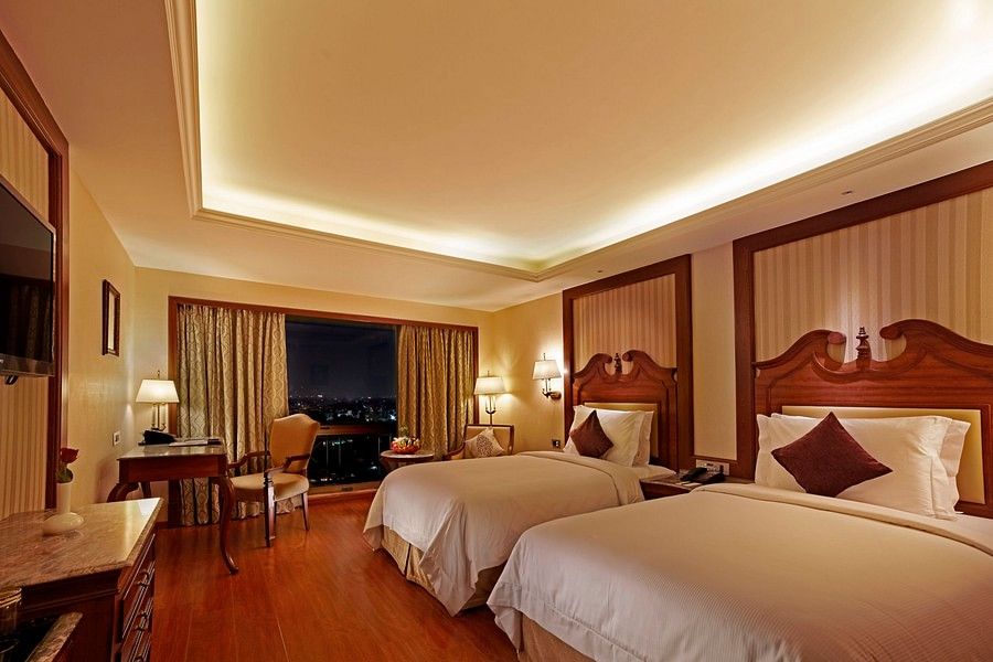 Spacious rooms with twin beds and windows overlooking the city at Hablis Hotel, Chennai