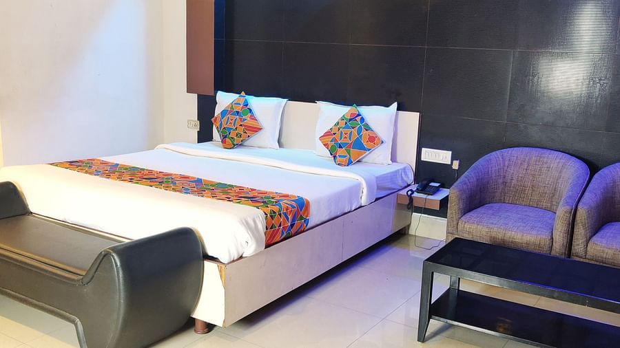 Deluxe Room: Stylish Deluxe Room at Udipi Home featuring contemporary decor and comfortable bedding