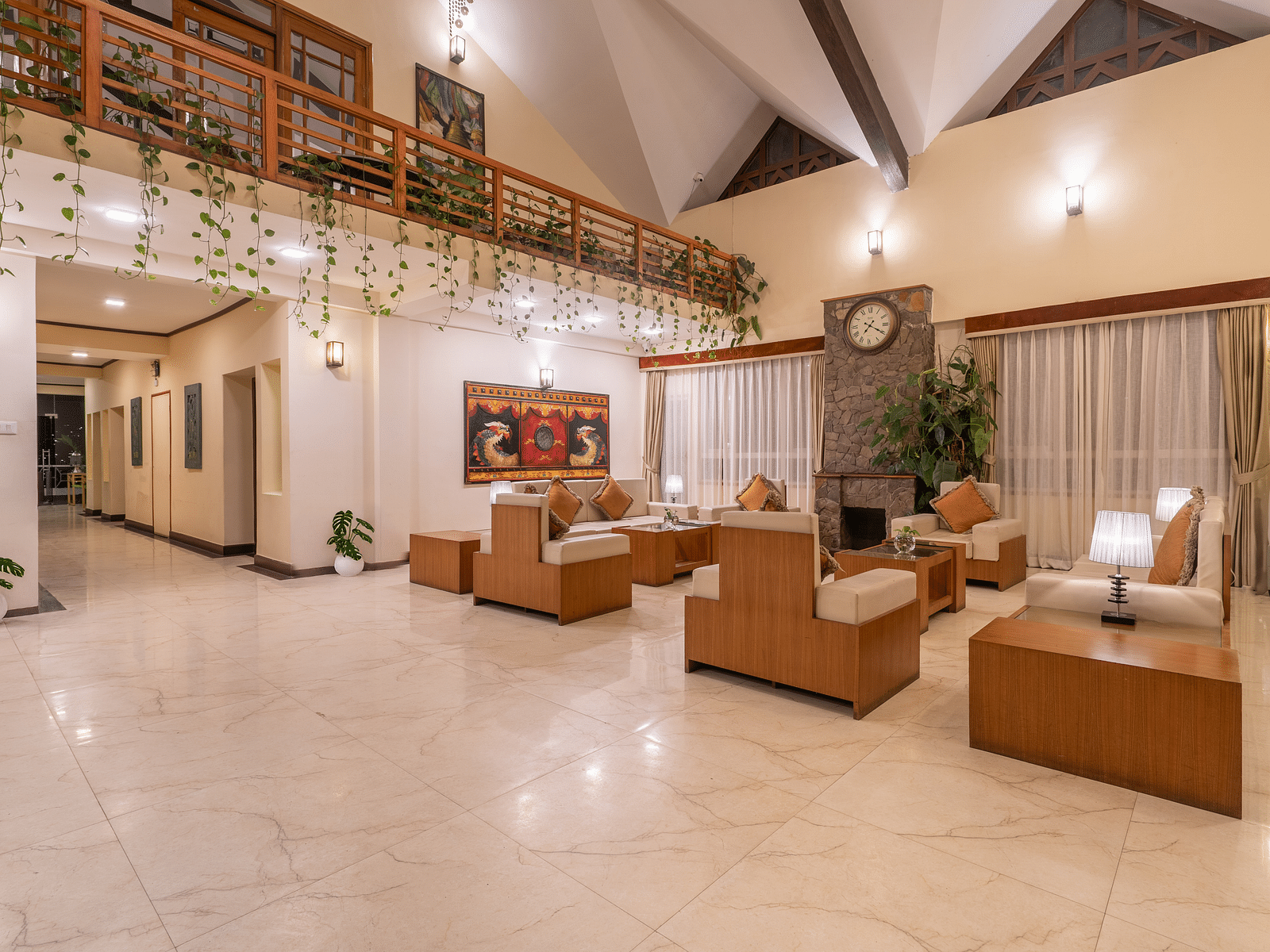 Image of the lobby at Summit Lillium Hotel & Spa, Kalimpong with seating area and windows on the side.