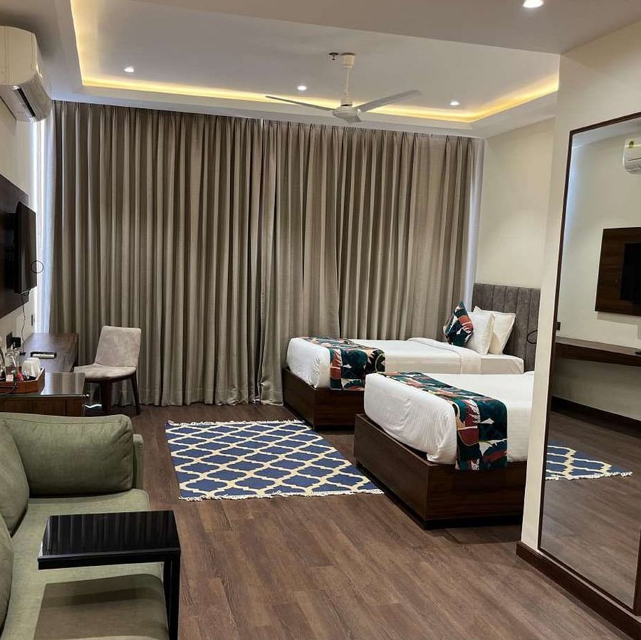 premium city twin bed room with 2 single beds and TV at Aura Boutique Hotel, Udaipur