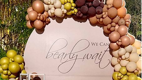 Poster of the 'Balloon Bonanza' featuring an image of an intimate ceremony setup and the inclusions of the offer - Karma Chalets