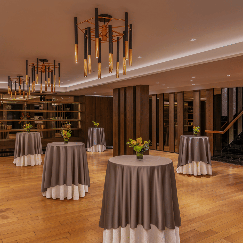 Banquet hall with round tables, chairs, and floral decorations at The Raintree, St. Mary’s Road.