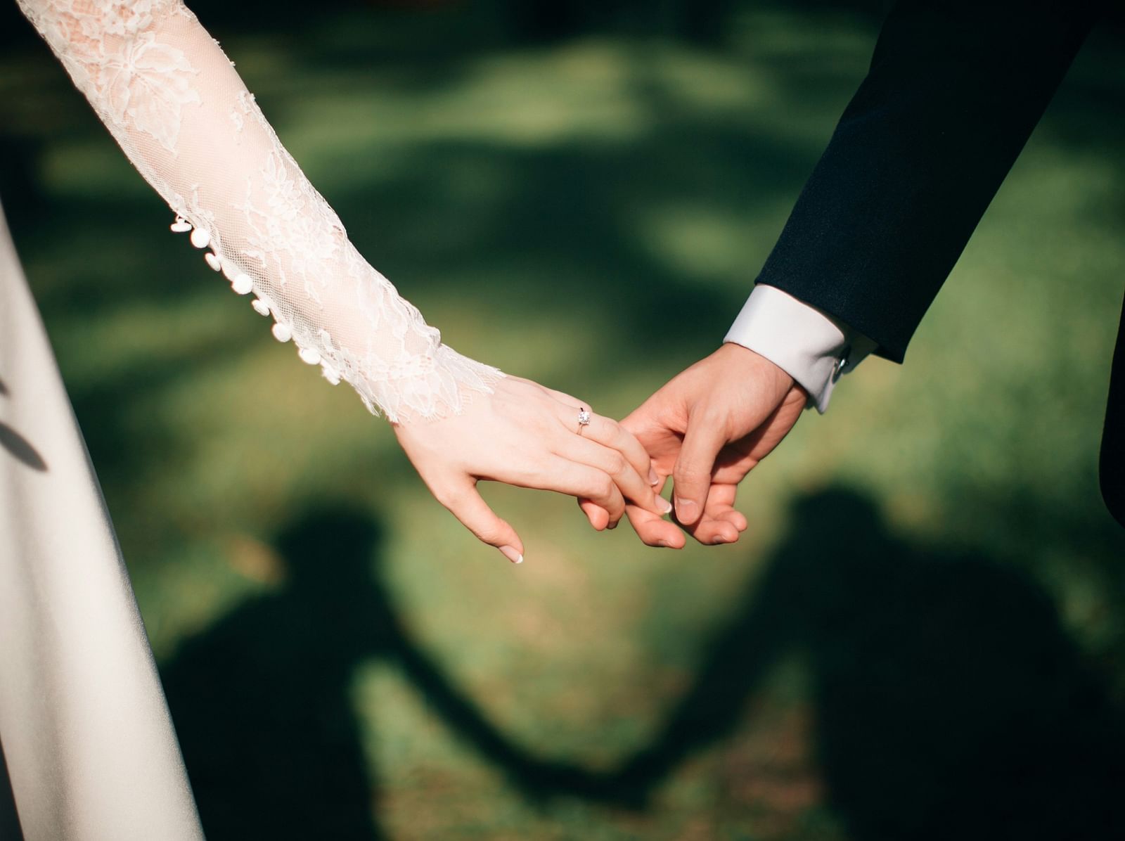 an image of a couple holding hands