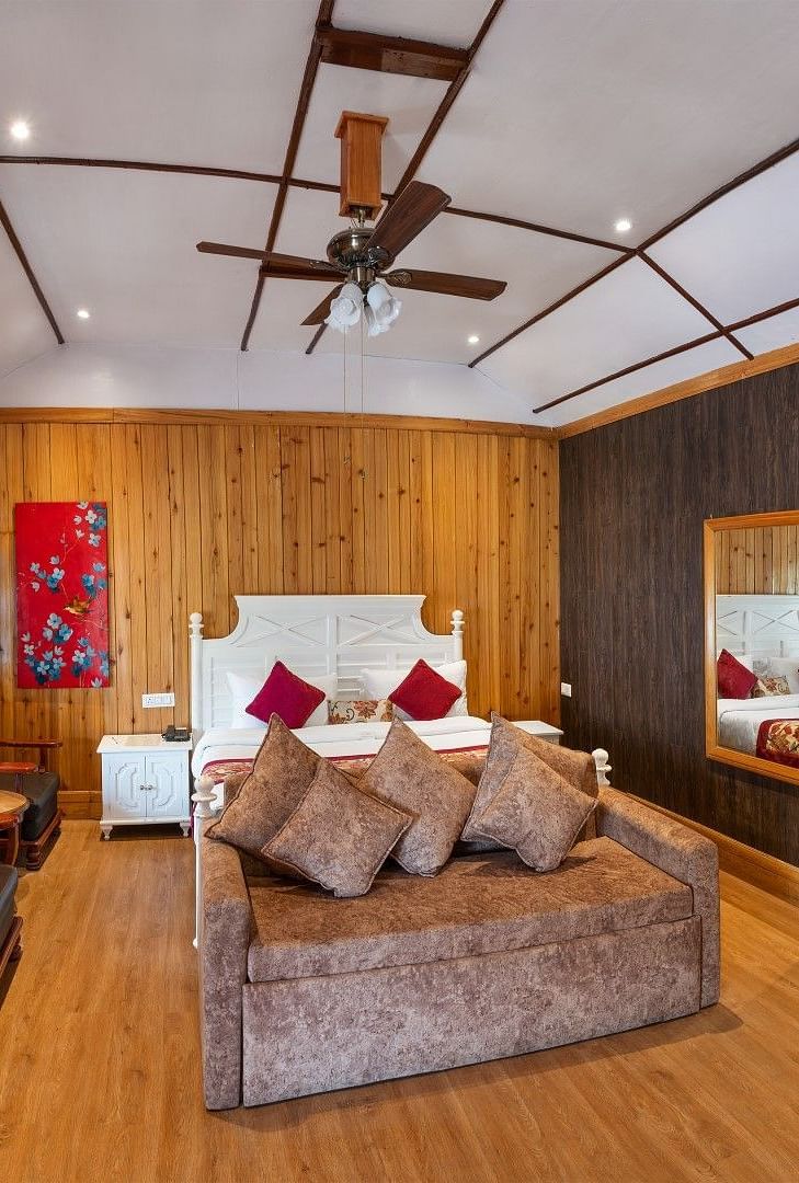 A room at Summit Barsana Resort & Spa, Kalimpong with a double bed 