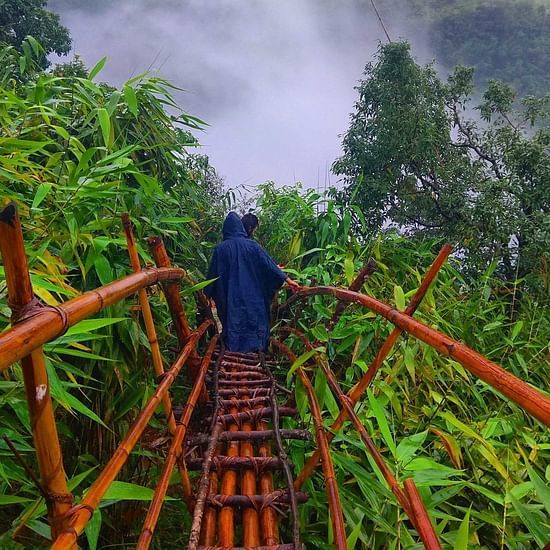 people crossing a bridge