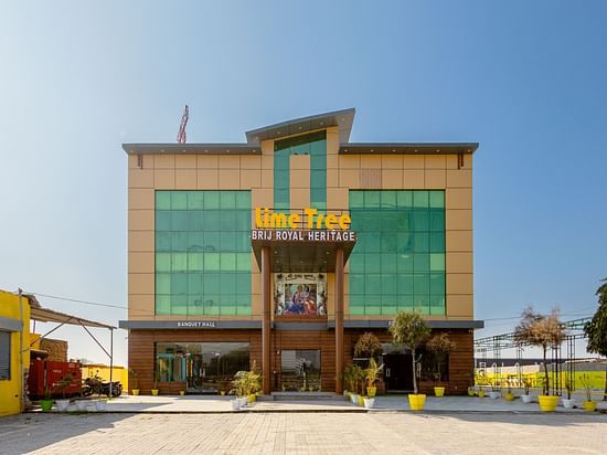 facade image of the Lime Tree Hotels and Banquet Vrindavan on a bright sunny day