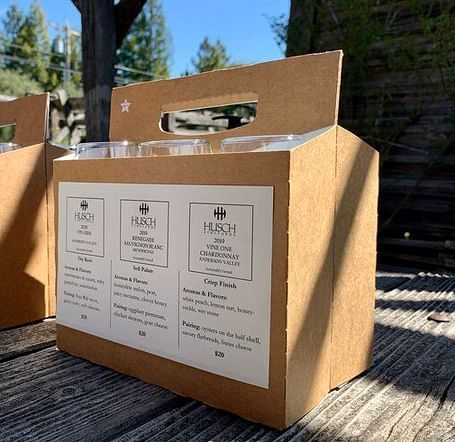 An image of a packet where glasses are placed and the packaging is labelled as Husch