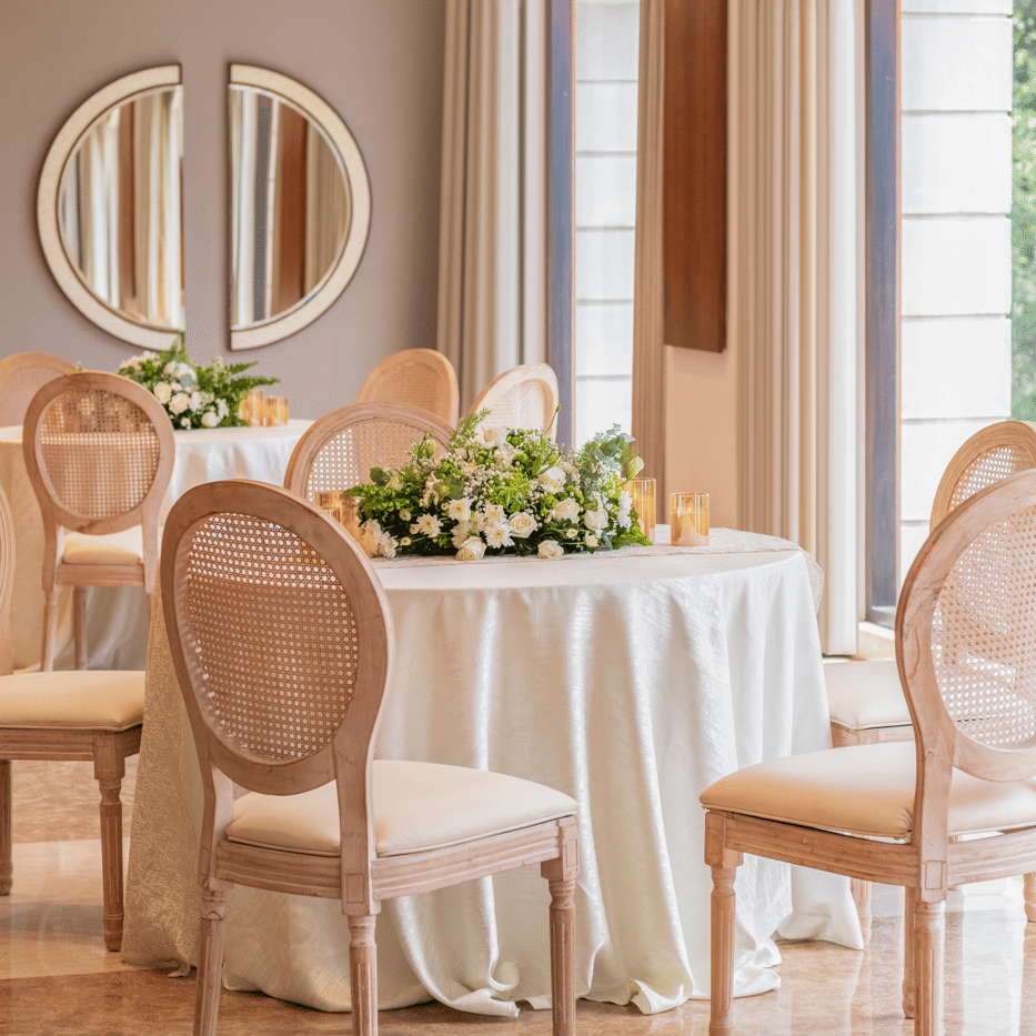 Dining area with round table and chairs near window at The Raintree, St. Mary’s Road.
